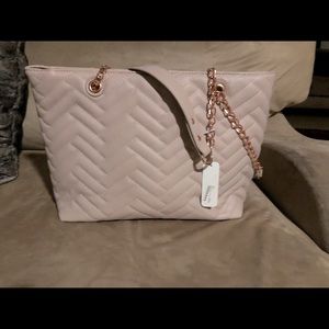 Beige handbag with gold chain shoulder strap